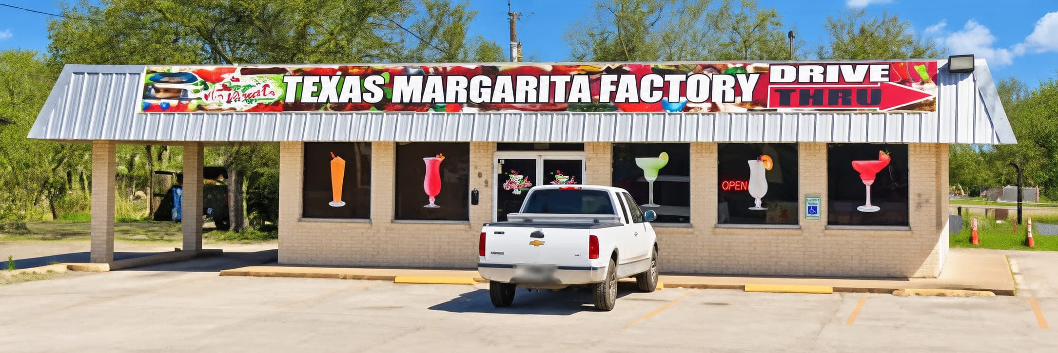 The long cream brick building with a margarita glass painted in every window and a neon Open sign lit up